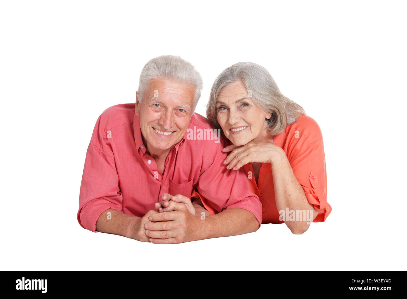 Ritratto di felice coppia senior su sfondo bianco Foto Stock