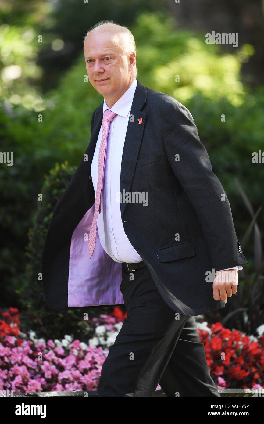 Segretario dei trasporti Chris Grayling arriva per una riunione del gabinetto a 10 Downing Street, Londra. Foto Stock