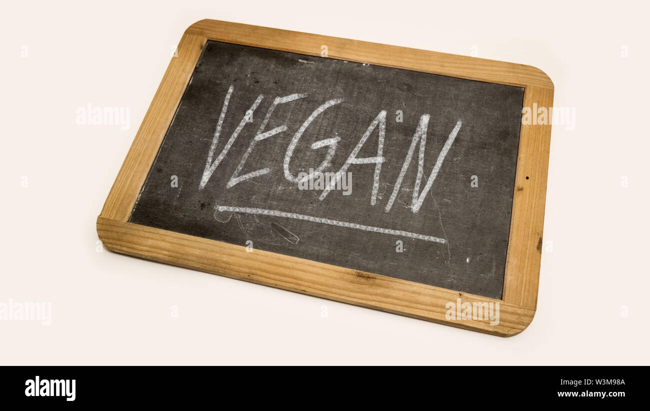 Vegani scrivere sulla lavagna Foto Stock