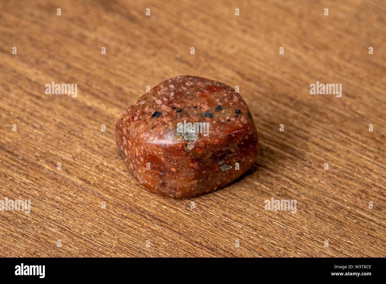 Unakit rara gemma lucido lucido diversi toni di marrone e rosso arancione Foto Stock