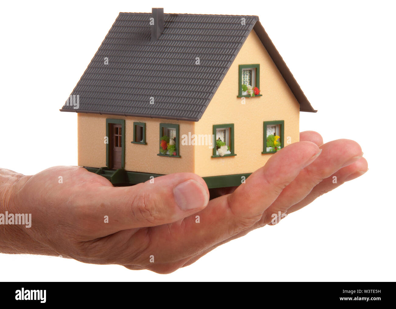 Modello di casa in mano di agent Foto Stock