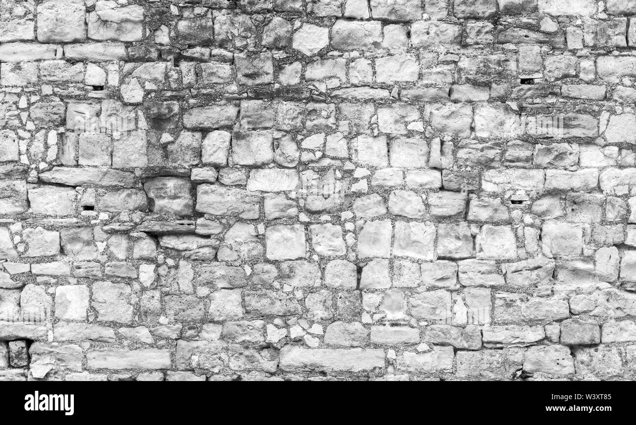 Bianco antico muro di pietra, vista frontale, foto di sfondo texture Foto Stock