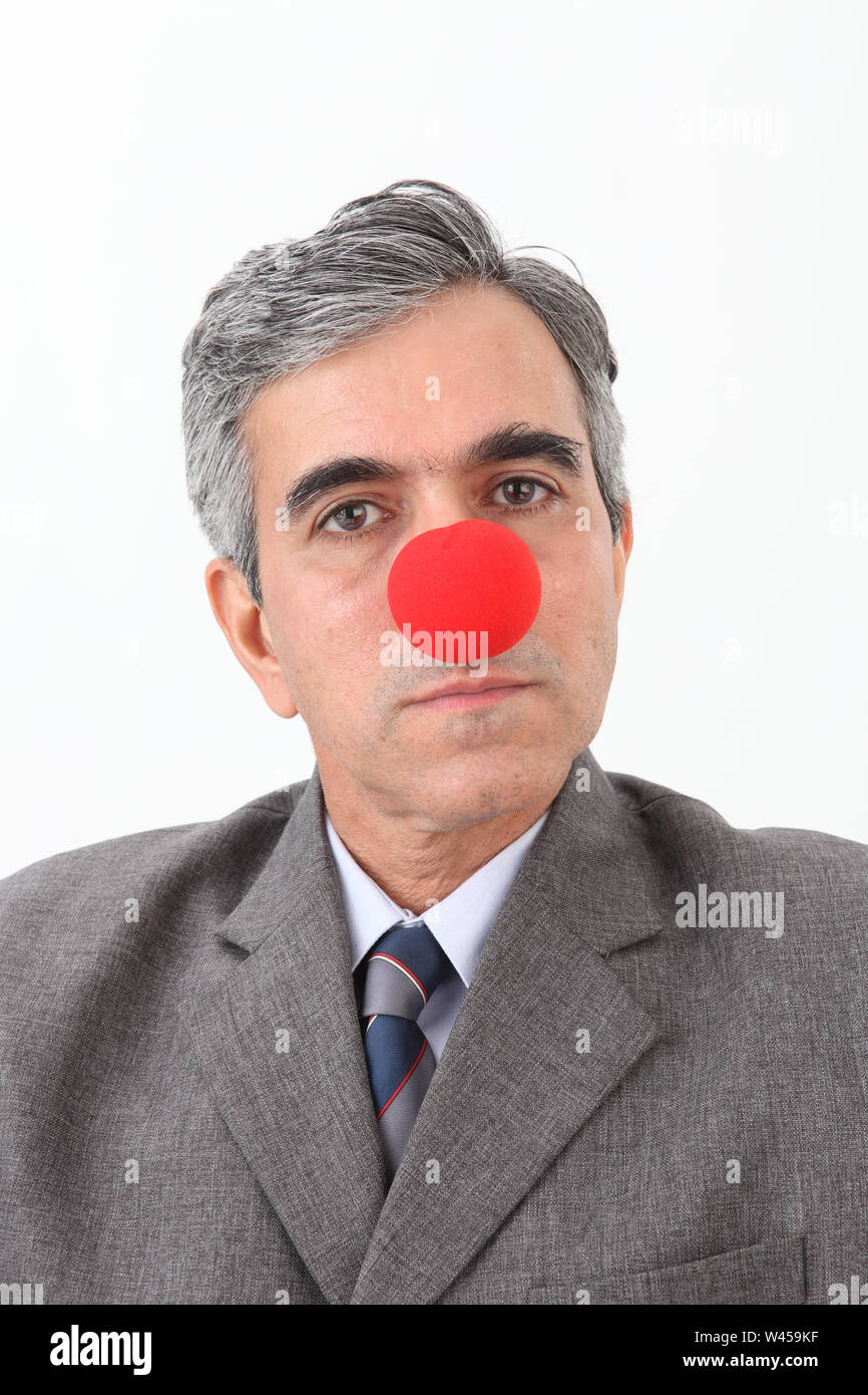 Ritratto di un imprenditore che indossa il clown naso Foto Stock