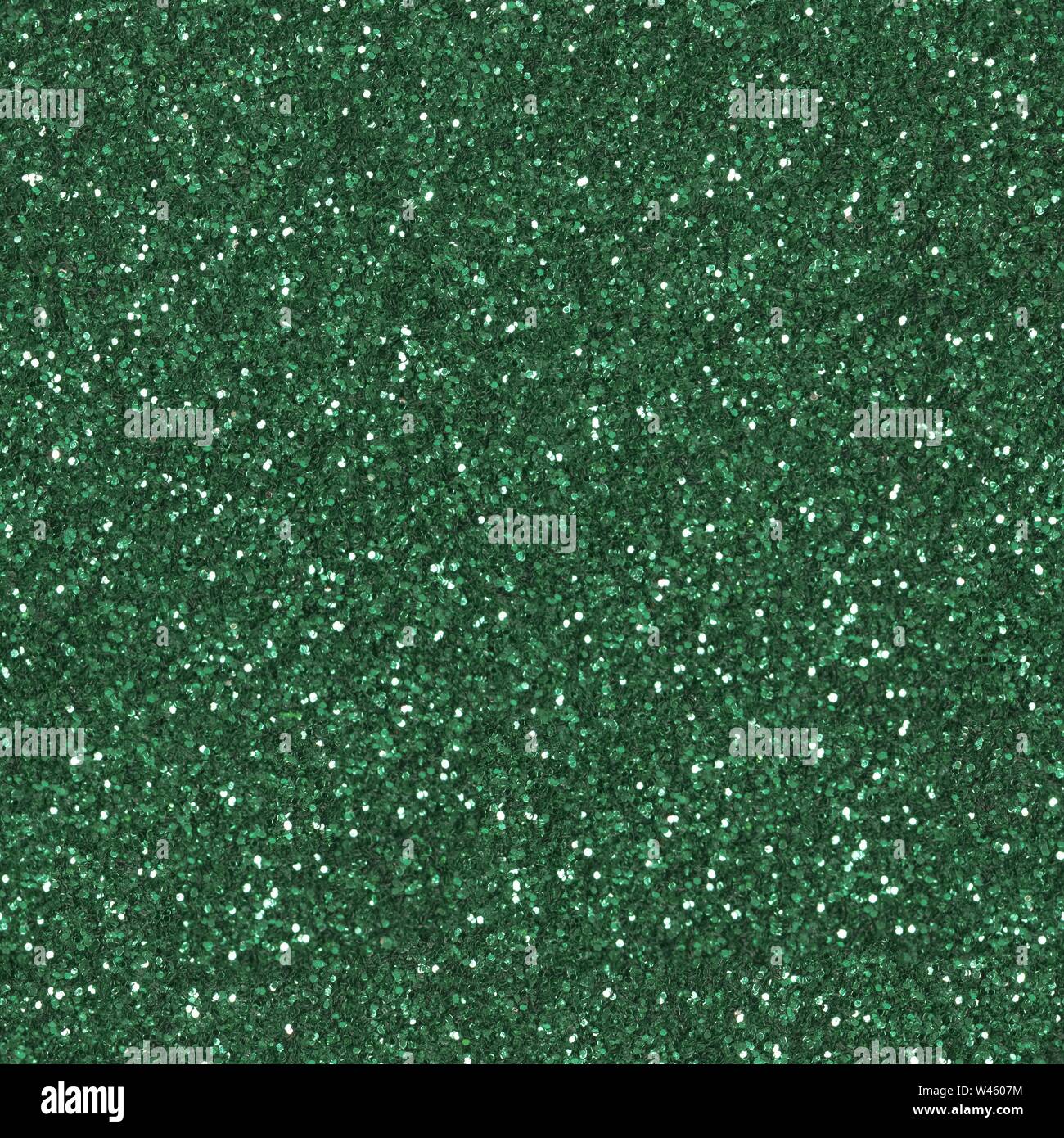 Glitter verde dello sfondo. Un basso contrasto foto. Piazza Seamless texture. Piastrella pronto. Foto Stock