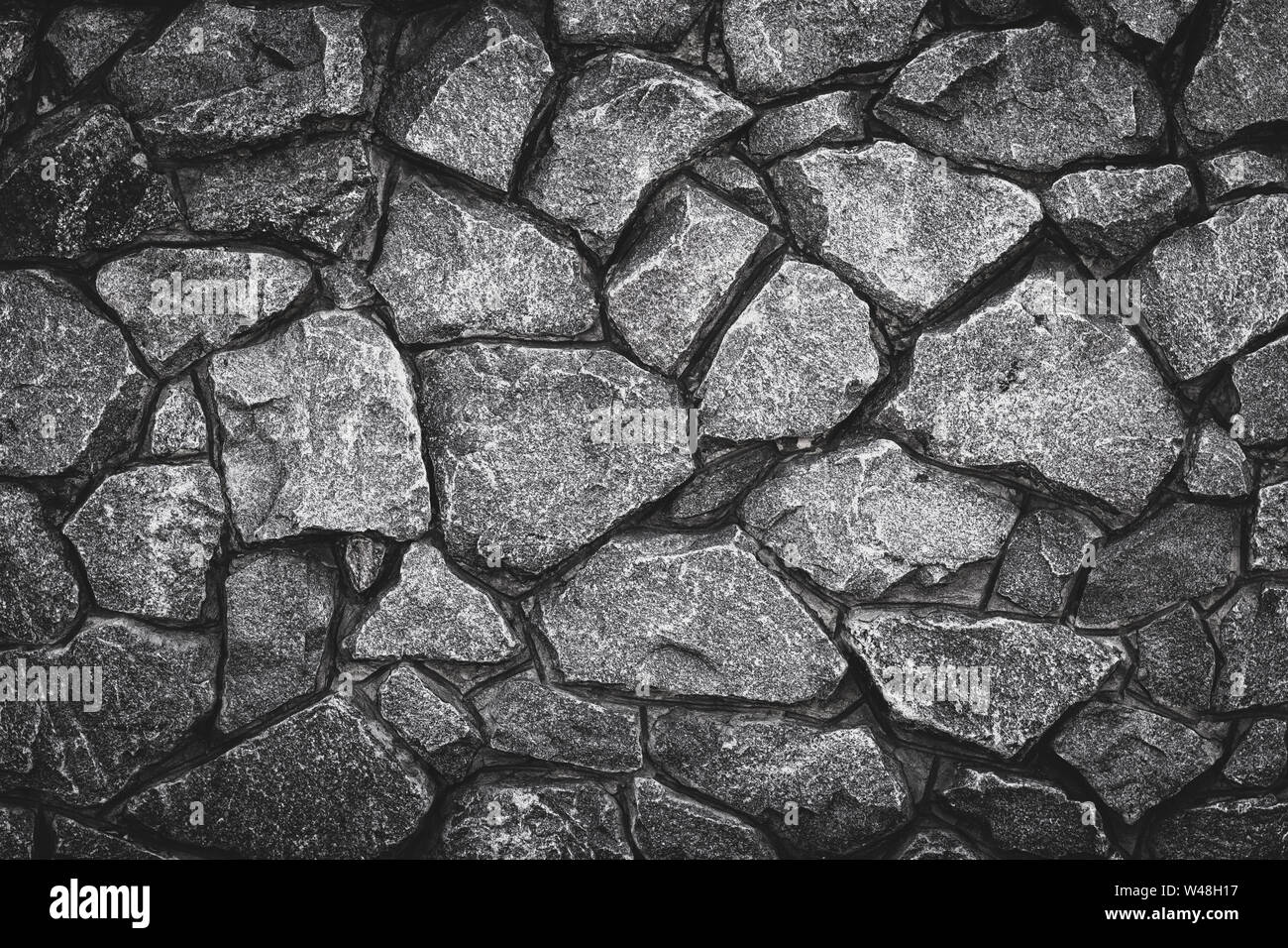 Modello grigio del muro di pietra dello sfondo. Abstract grigio texture grunge, rocky road. Il granito grigio superficie, piano. Il vecchio muro di pietra, la muratura di mattoni. Testo di roccia Foto Stock