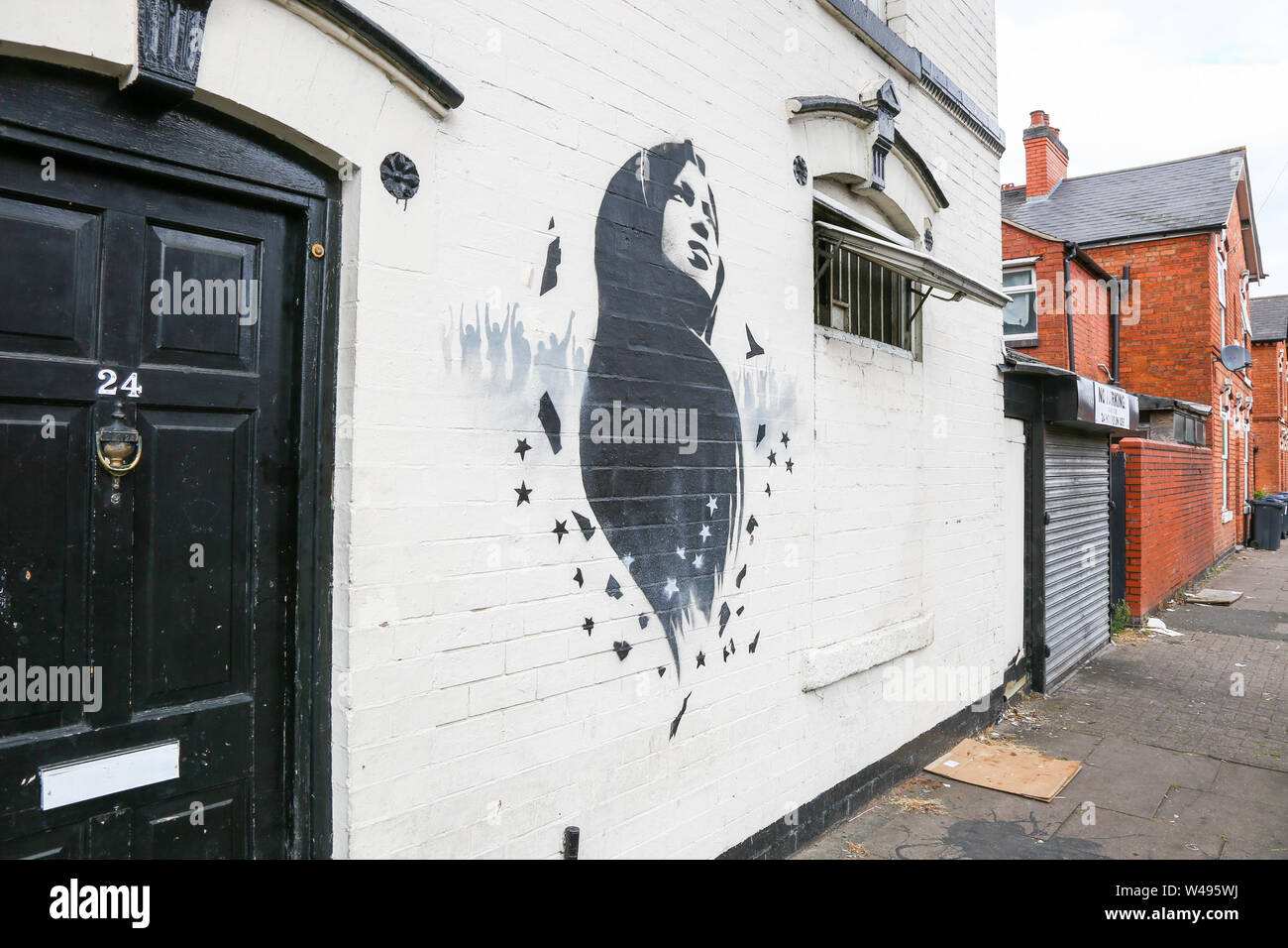 Omar Ilhan murale o arte dei graffiti su un muro, Birmingham, Small Heath, Regno Unito Foto Stock