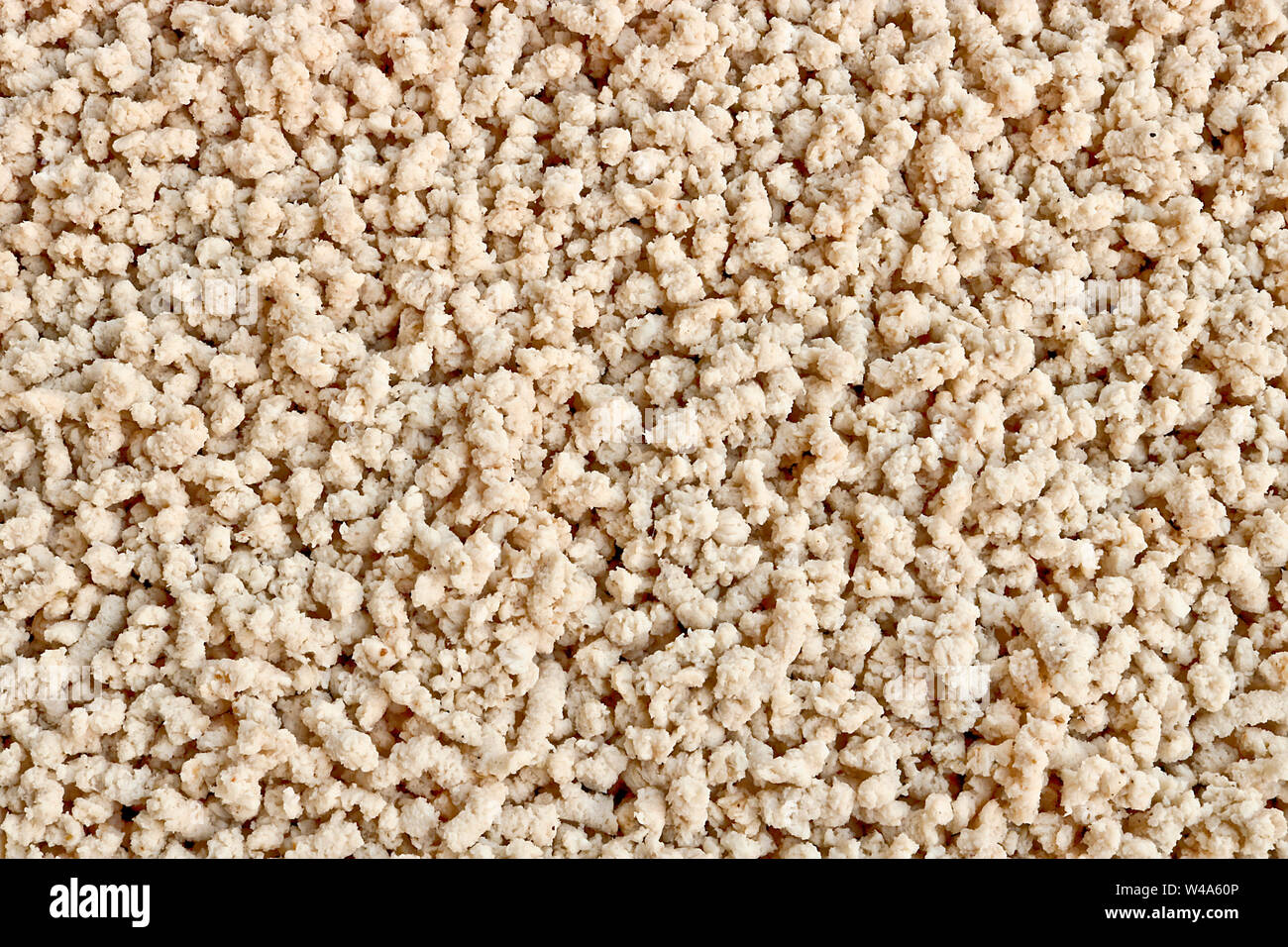 Texture culinaria - massa trito di pollo. Piatto pronto. Macinato di carne bollita. Foto Stock