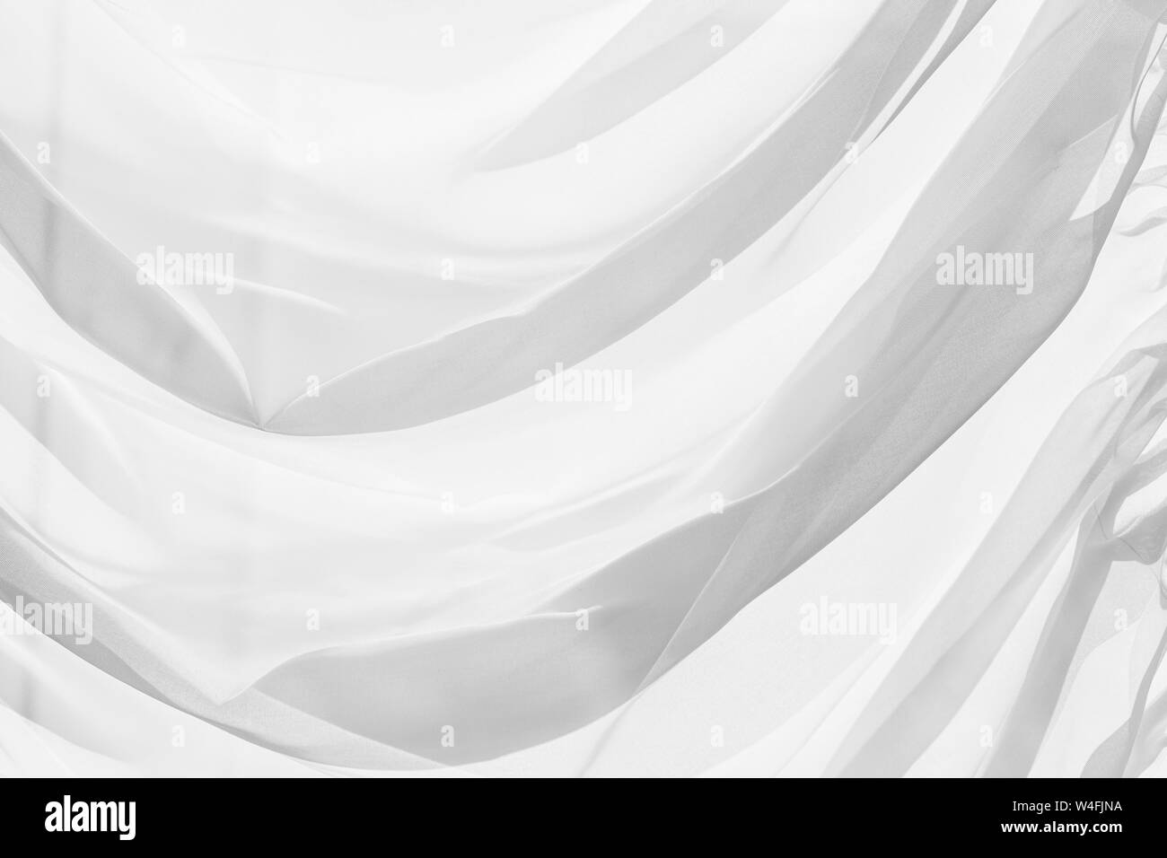 Decorativo in tulle bianco con pieghe, close-up foto di sfondo texture Foto Stock