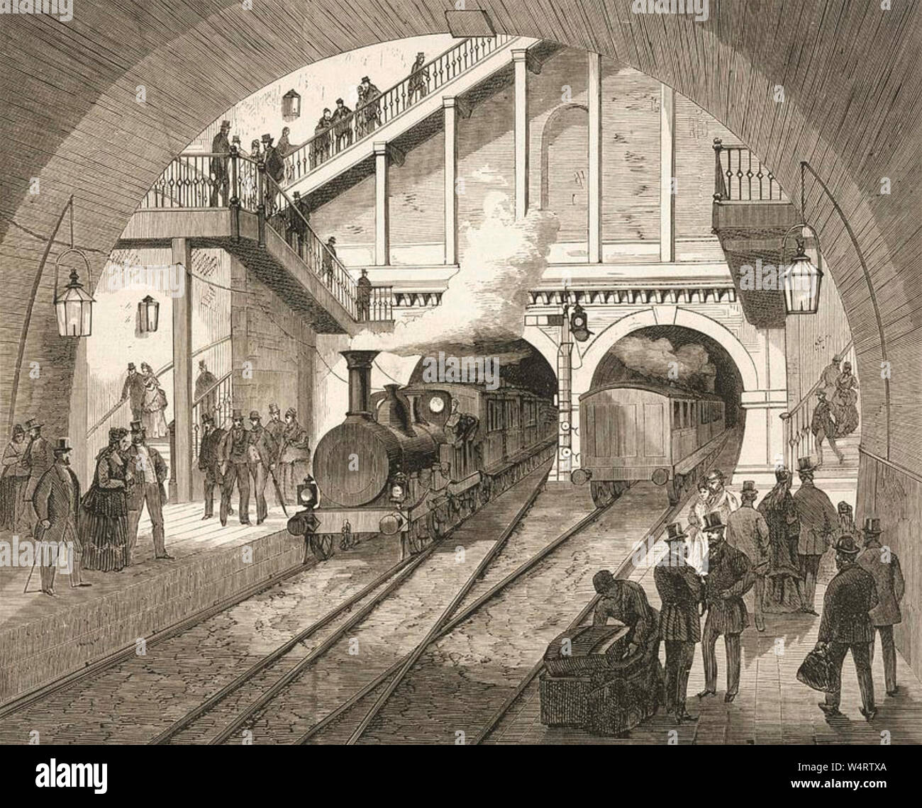 WAPPING STAZIONE, London, 1870 circa che mostra un treno a vapore che arrivano attraverso il Tunnel Tamigi Foto Stock