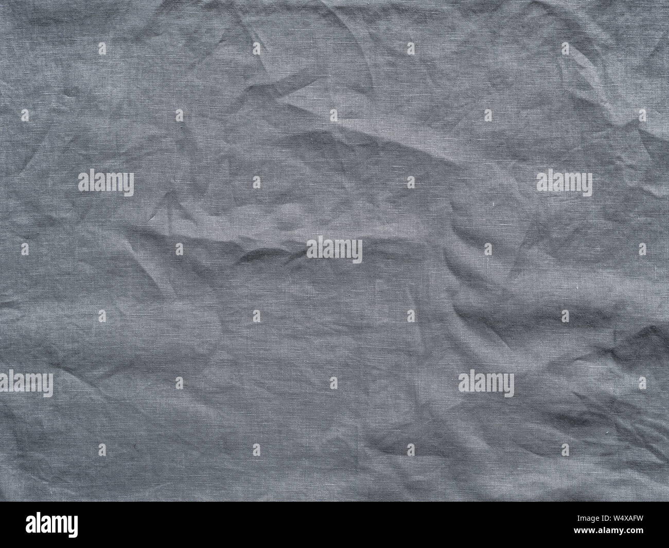 Lino grigio texture come sfondo. Lino Grigio Raggrinzato tovaglia. Si può utilizzare come mock up per la progettazione. Copia spazio per il testo Foto Stock