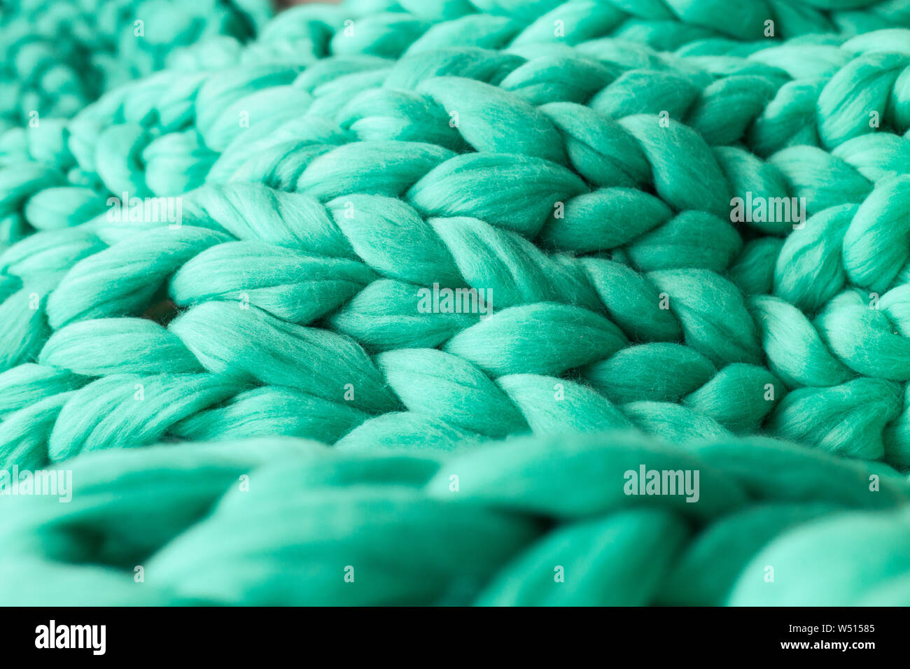 Close-up del tessuto lavorato a maglia a una coperta di lana merinos sfondo Foto Stock