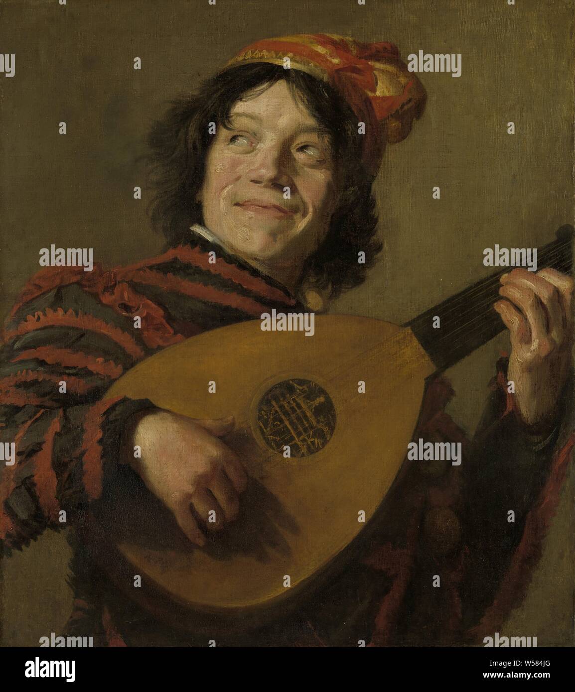 Il liuto Player, il buffone. Ragazzo sorridente con vestiti colorati giocando su un liuto. Vecchia copia dopo l'originale al Louvre di Parigi. Frans Hals (copia dopo), c. 1623 - 1624, tela, pittura a olio (vernice), supporto: h 67 cm × W 60 cm d 4 cm Foto Stock