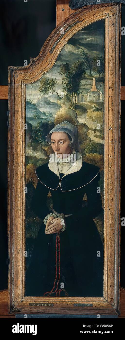 Ala di un trittico con il ritratto di Elisabetta Canneel, pannello laterale destro di un trittico. All'interno il ritratto di Elisabetta Canneel, inginocchiato nel culto in un paesaggio. All'esterno il suo stemma di famiglia., anonimo, Bruges, 1584, pannello, pittura a olio (vernice), h 83 cm × W 25,5 cm h 94,3 cm × W 33,6 cm × d 3,5 cm Foto Stock