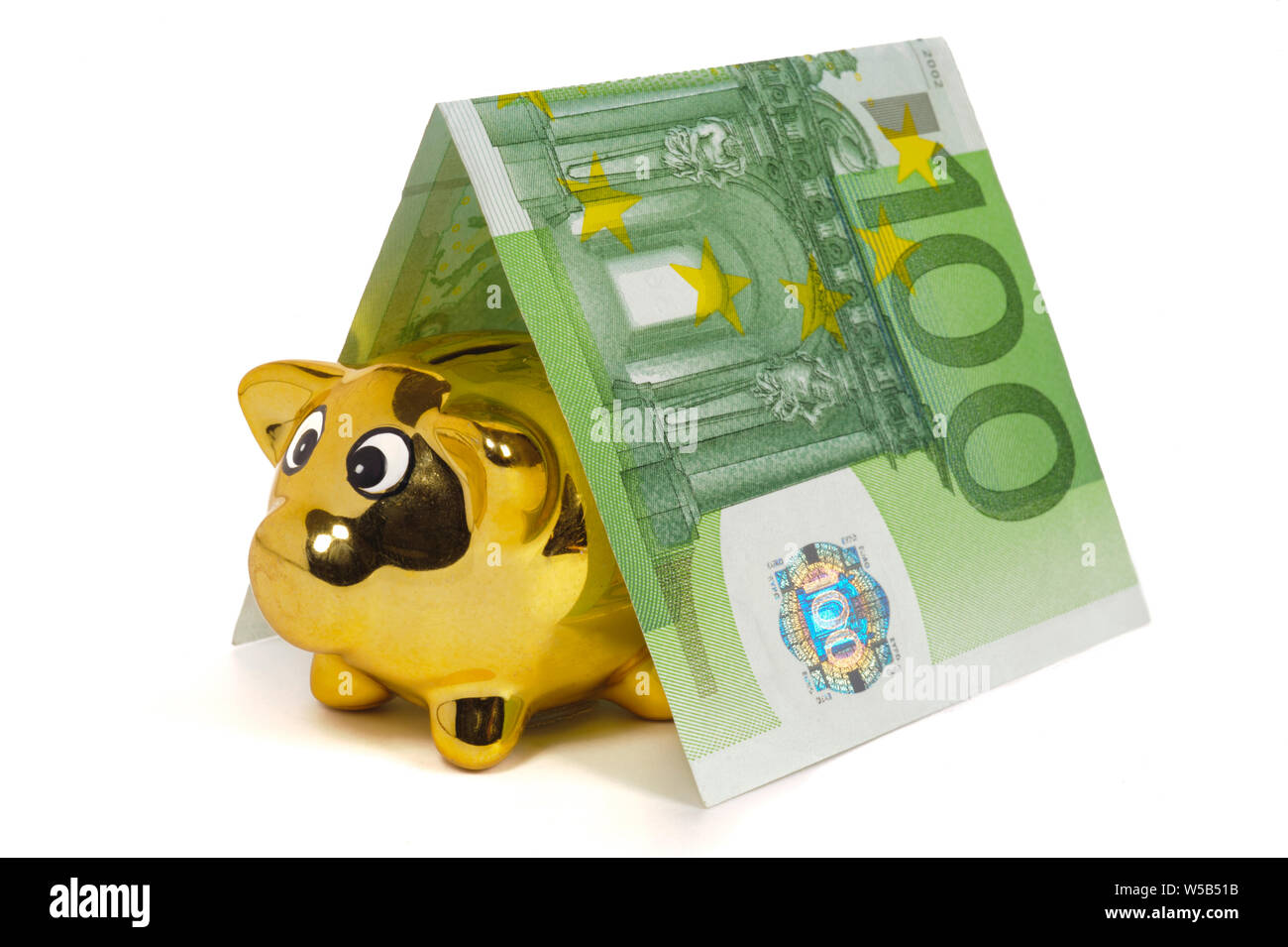 Casa modello costruito con banconote di euro moneta e salvadanaio Foto Stock