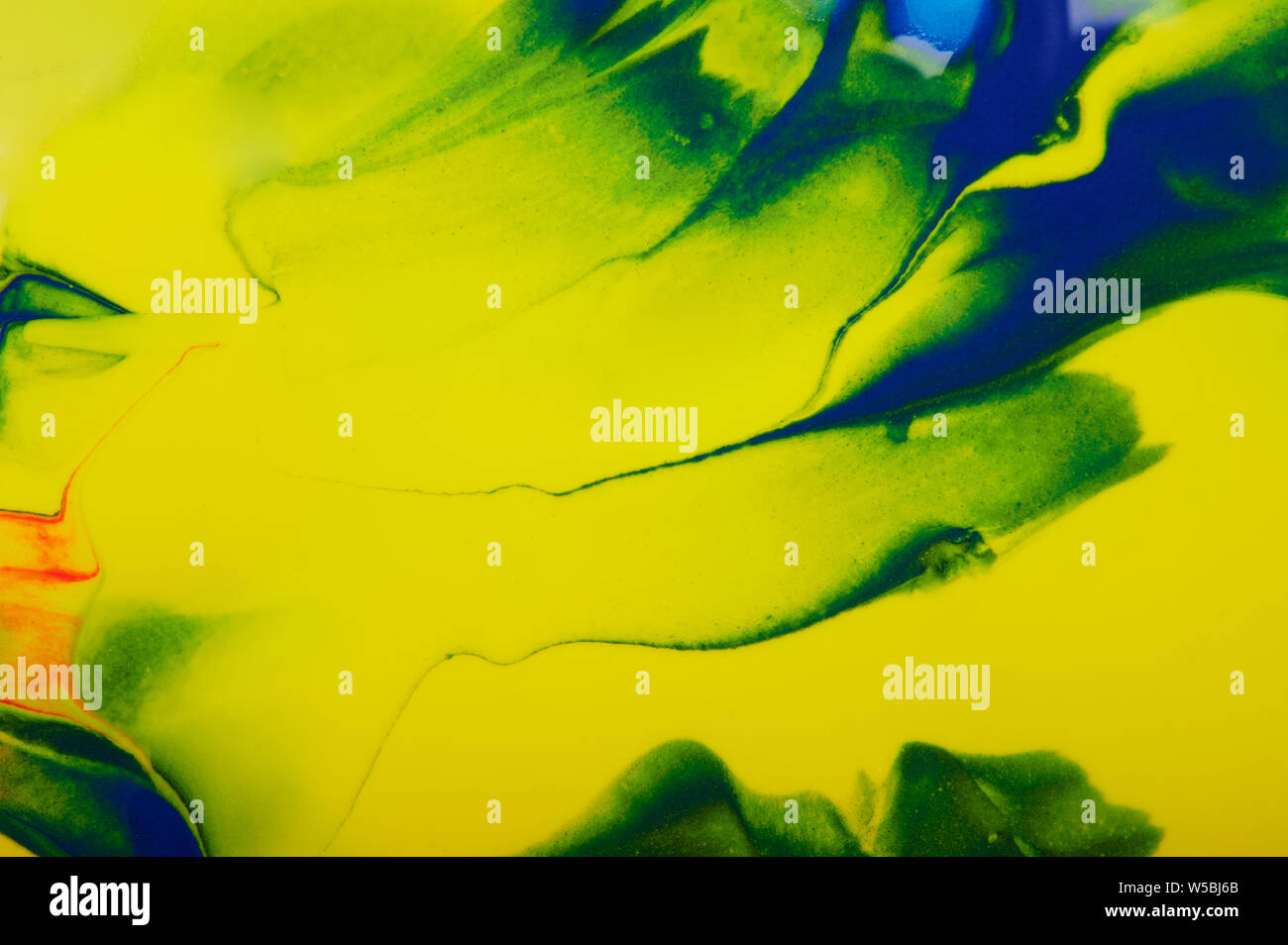 Abstract giallo e verde sullo sfondo di vernice vista ravvicinata Foto Stock