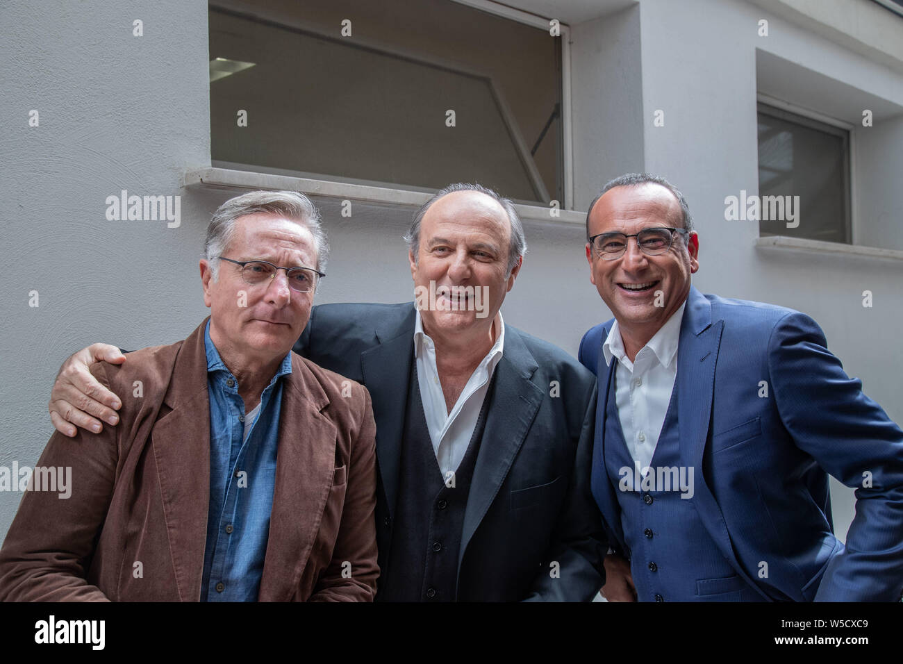 Paolo Bonolis Carlo Conti e Jerry Scotti assiste al Maurizio Costanzo Show Foto Stock