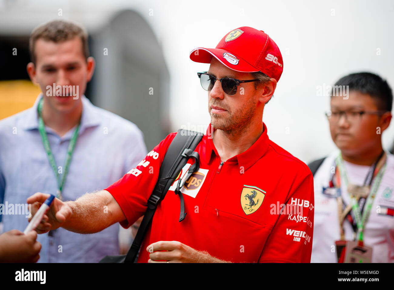 Hockenheim, Germania. 28 Luglio, 2019. Sebastian Vettel di Germania passeggiate attraverso il paddock prima di iniziare il tedesco F1 Grand Prix gara. Credito: SOPA Immagini limitata/Alamy Live News Foto Stock