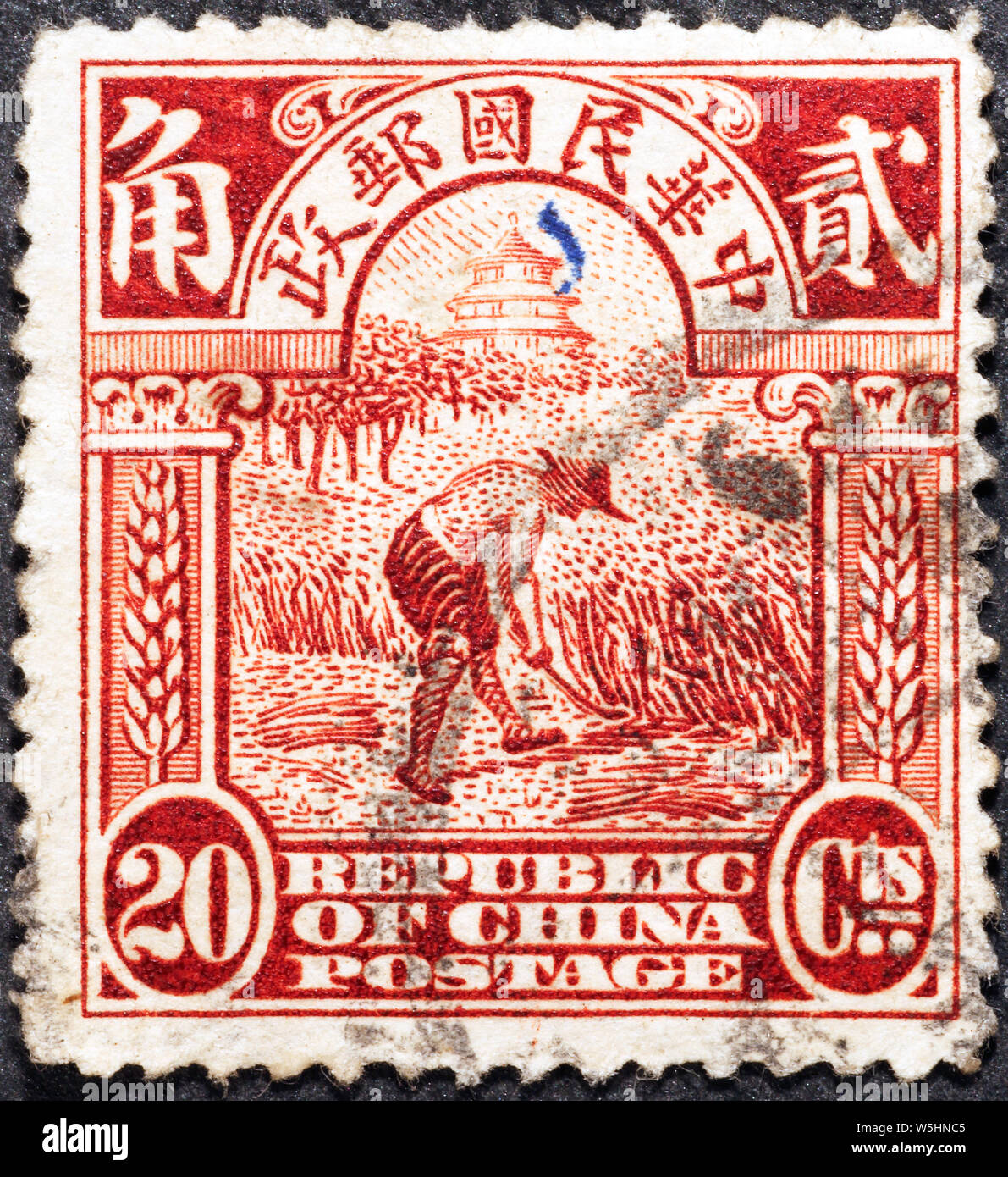 L'agricoltore cinese su antiche francobollo Foto Stock