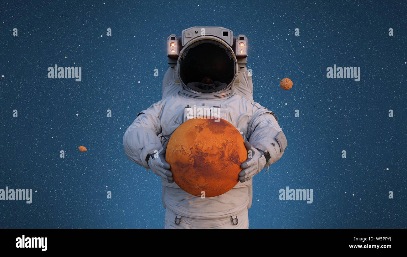 Astronauta holding Marte, Phobos e Deimos in orbita attorno al pianeta Foto Stock