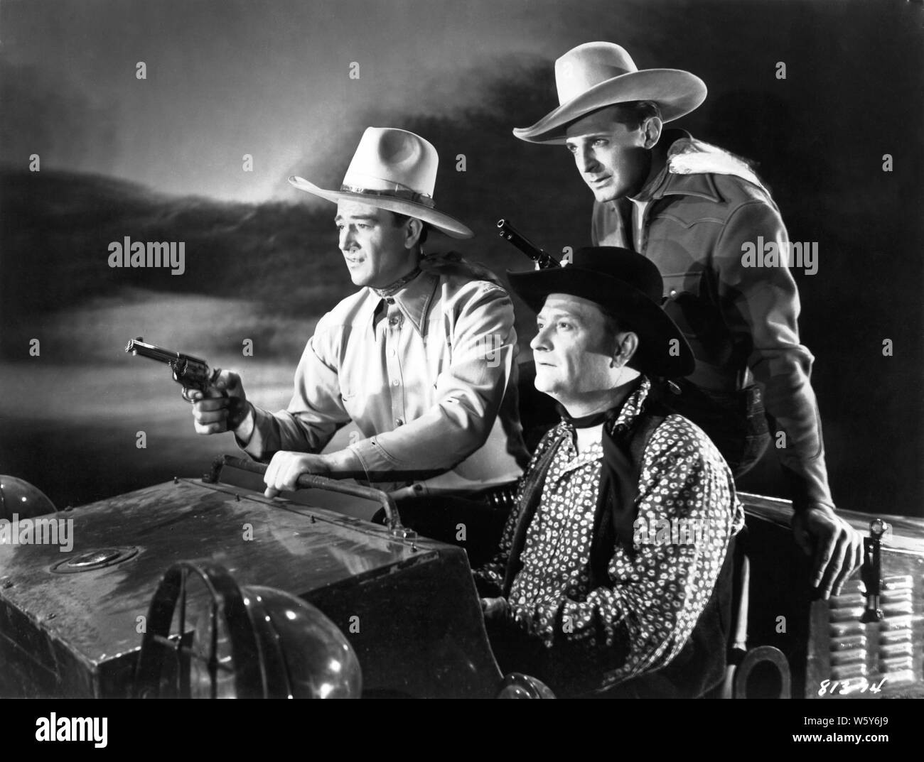 JOHN WAYNE MAX TERHUNE RAY CORRIGAN come i tre mesquiteers in TRE TEXAS STEERS 1939 direttore George Sherman Republic Pictures Foto Stock