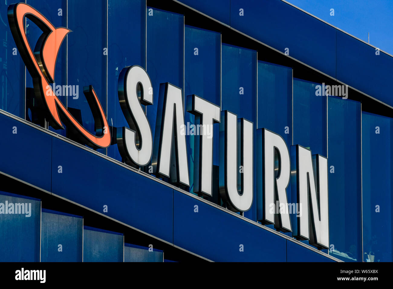 Saturno, Logo Werbung, Europacenter, Breitscheidplatz, Charlottenburg di Berlino, Deutschland Foto Stock