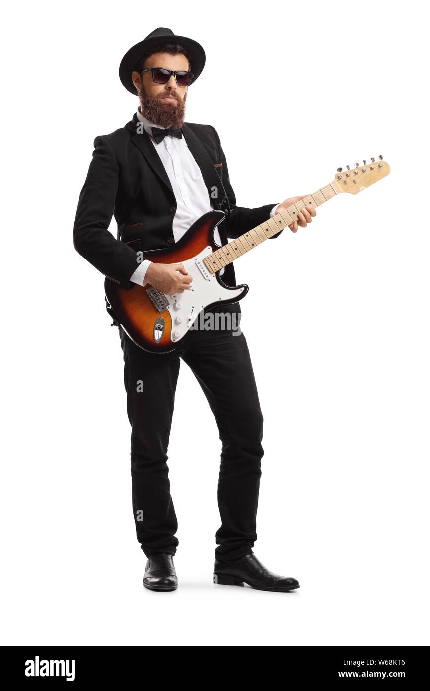 A piena lunghezza Ritratto di un maschio chitarrista in una tuta isolati su sfondo bianco Foto Stock