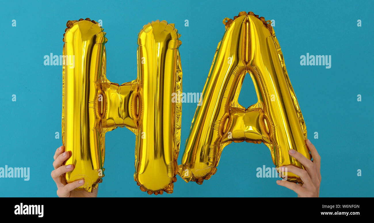 Golden HA parola fatta di palloncini gonfiabili Foto Stock