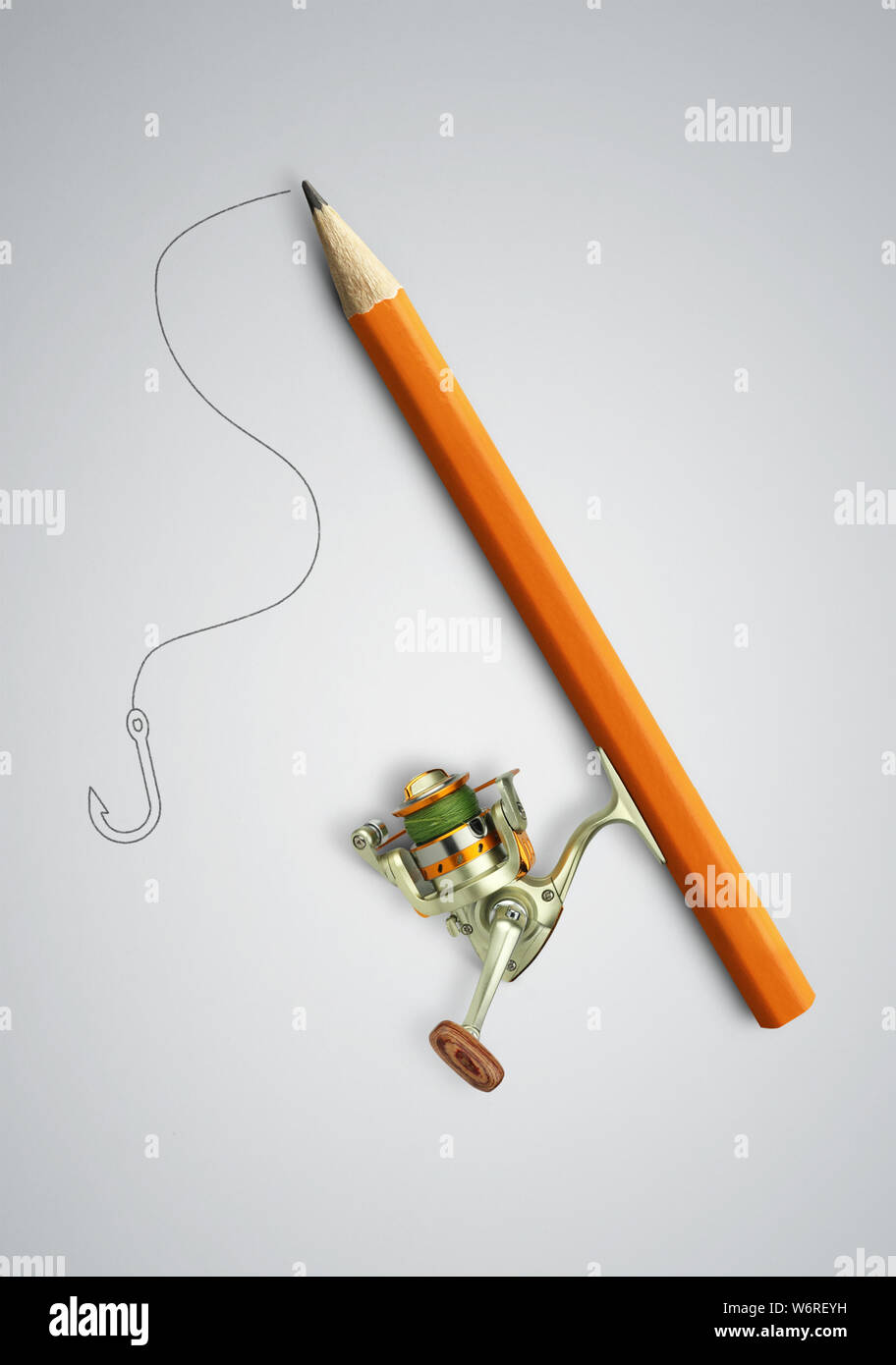Idea concetto creativo, matita come canna da pesca Foto Stock