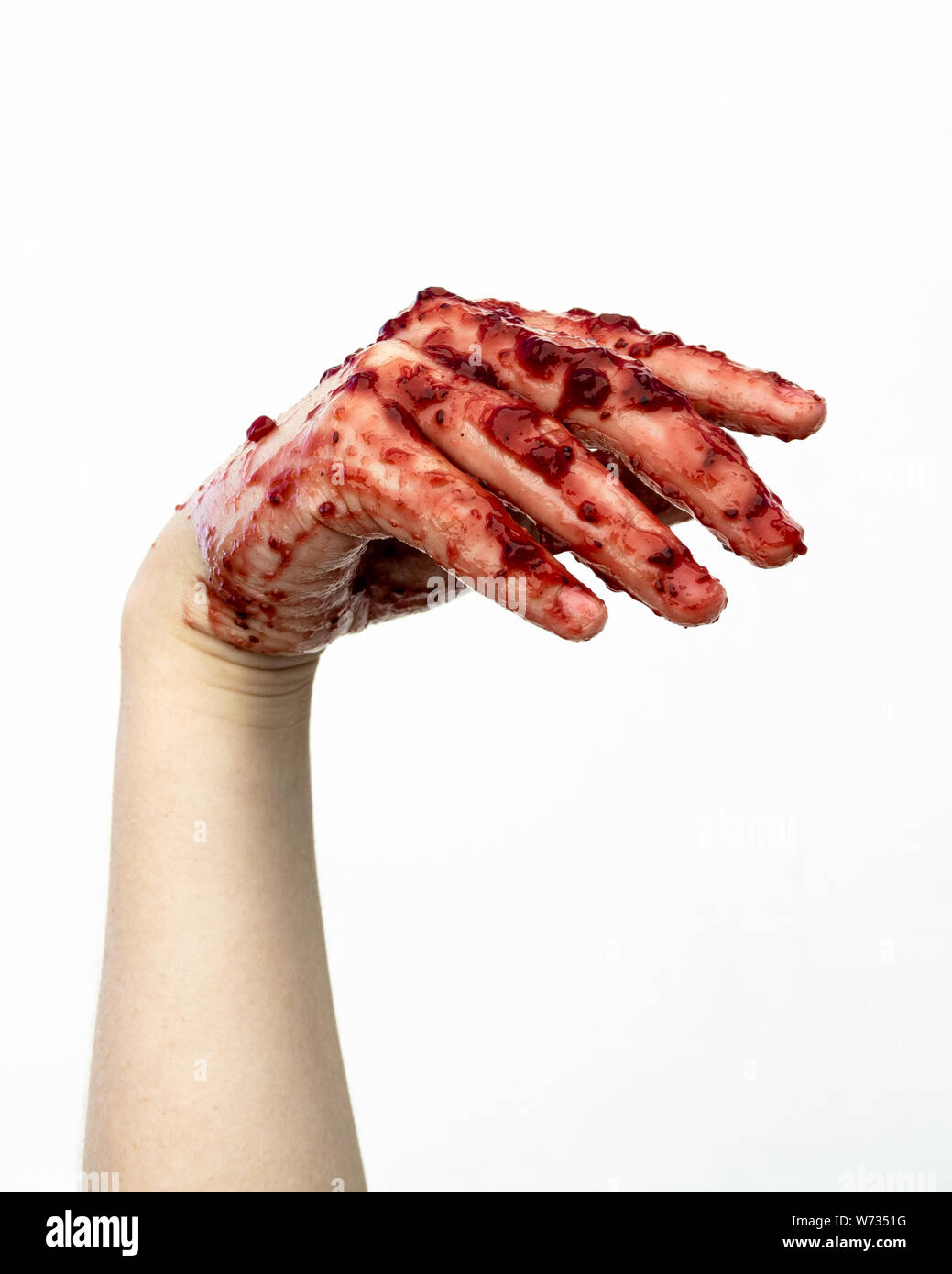 Pincture di una mano pongono wiith inceppamento o sangue tutti su di esso. Foto Stock