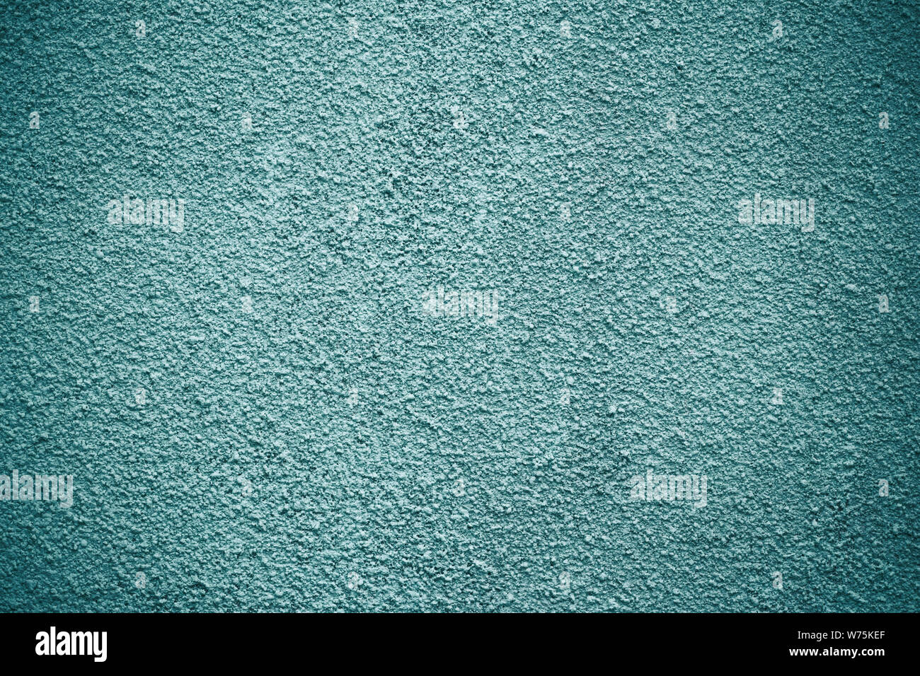 Sfondo a trama murale in stucco color verde scuro con motivo a grana fine, sfondo architettonico blu verdastro minimale per Des Foto Stock