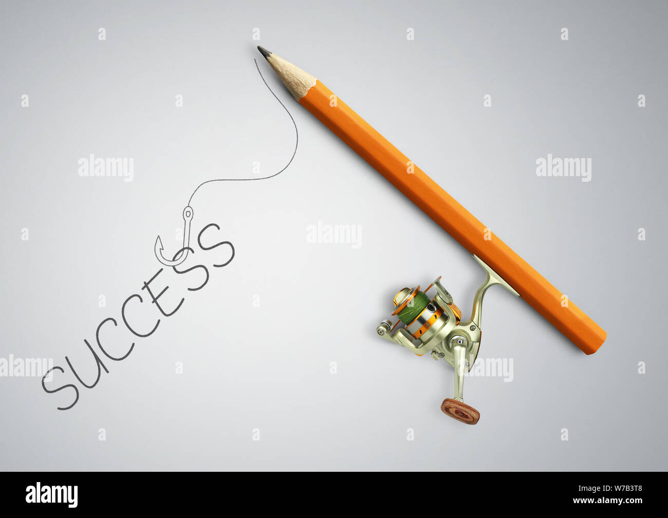 Idea concetto, matita come canna da pesca la cattura di successo Foto Stock
