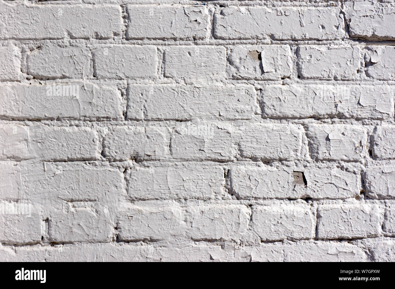 Abstract weathered texture colorate vecchio stucco grigio chiaro e di età compresa la vernice bianco muro di mattoni di sfondo nella camera rurale, grungy rusty blocchi di pietra te Foto Stock