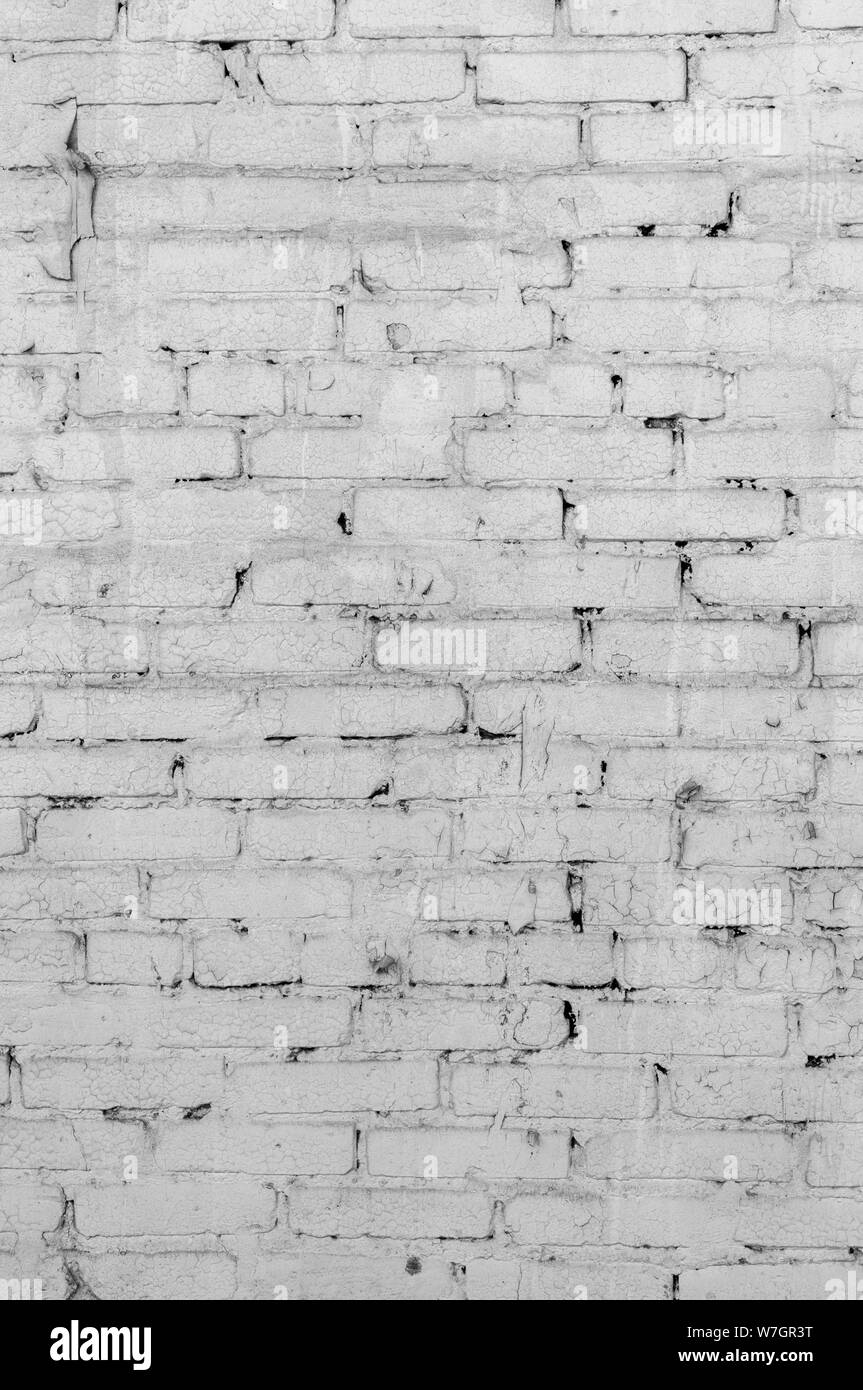 Abstract weathered texture colorate vecchio stucco grigio chiaro e di età compresa la vernice bianco muro di mattoni di sfondo nella camera rurale, grungy rusty blocchi di pietra te Foto Stock