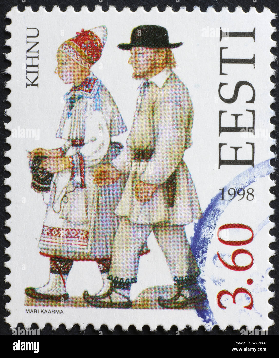 Giovane tradizionalmente condita sul francobollo di Estonia Foto Stock