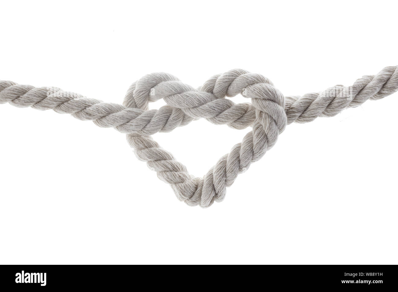 Forma di cuore il nodo della corda isolato su bianco Foto stock - Alamy