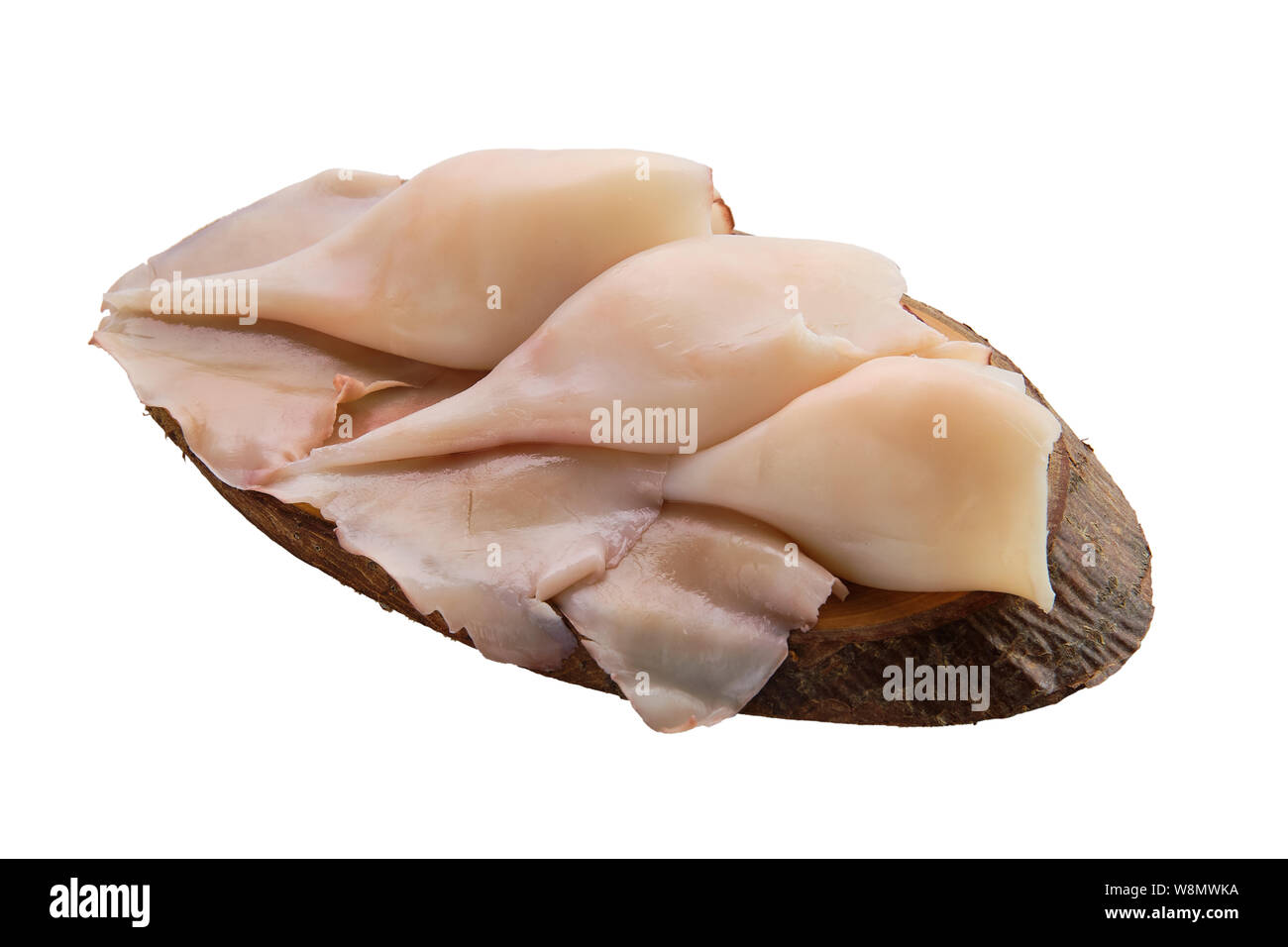 Congelati calamari disperse sul tavolo di legno Foto Stock