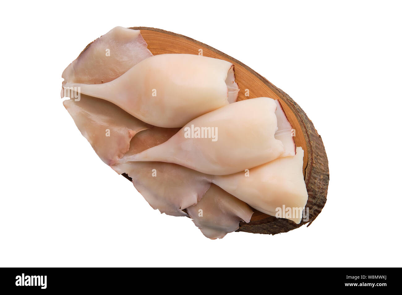 Congelati calamari disperse sul tavolo di legno Foto Stock