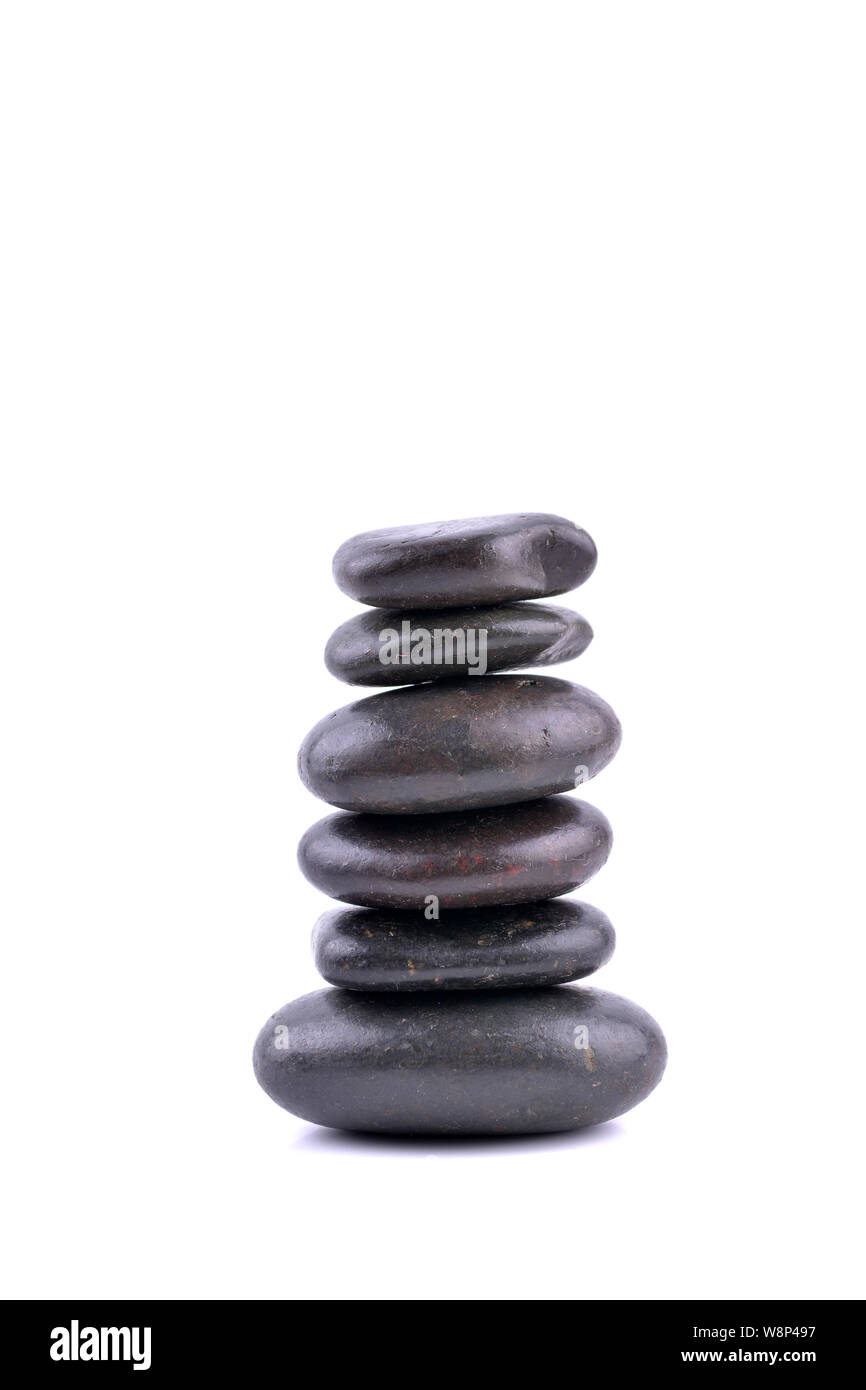 Pietre Zen equilibrio concetto isolato su bianco Foto Stock