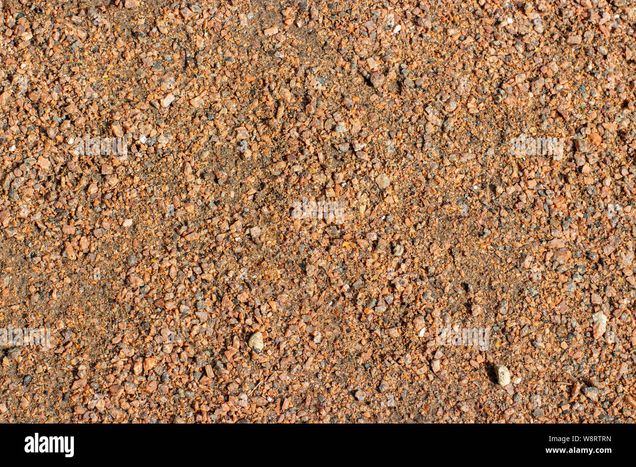 Rivestimento morbido di un sentiero di ghiaia di pietra frantumata crumb, texture di sfondo struttura Foto Stock