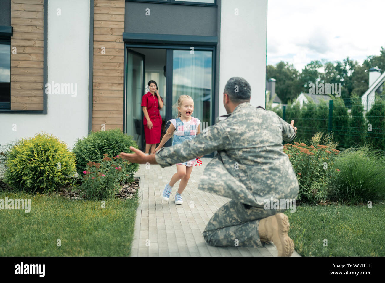 Mia moglie e mia figlia di incontrare i loro eroe americano a casa Foto Stock