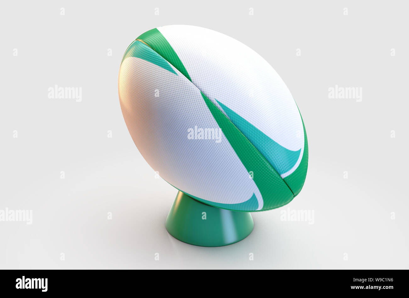 Un bianco a trama palla da rugby con un green design pattern in appoggio su di un verde kicking tee su un isolato sfondo bianco - 3D render Foto Stock