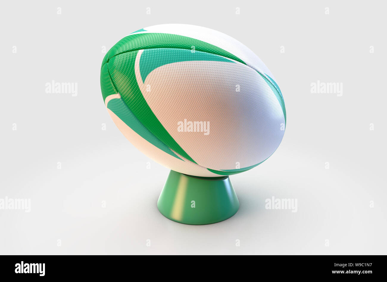 Un bianco a trama palla da rugby con un green design pattern in appoggio su di un verde kicking tee su un isolato sfondo bianco - 3D render Foto Stock