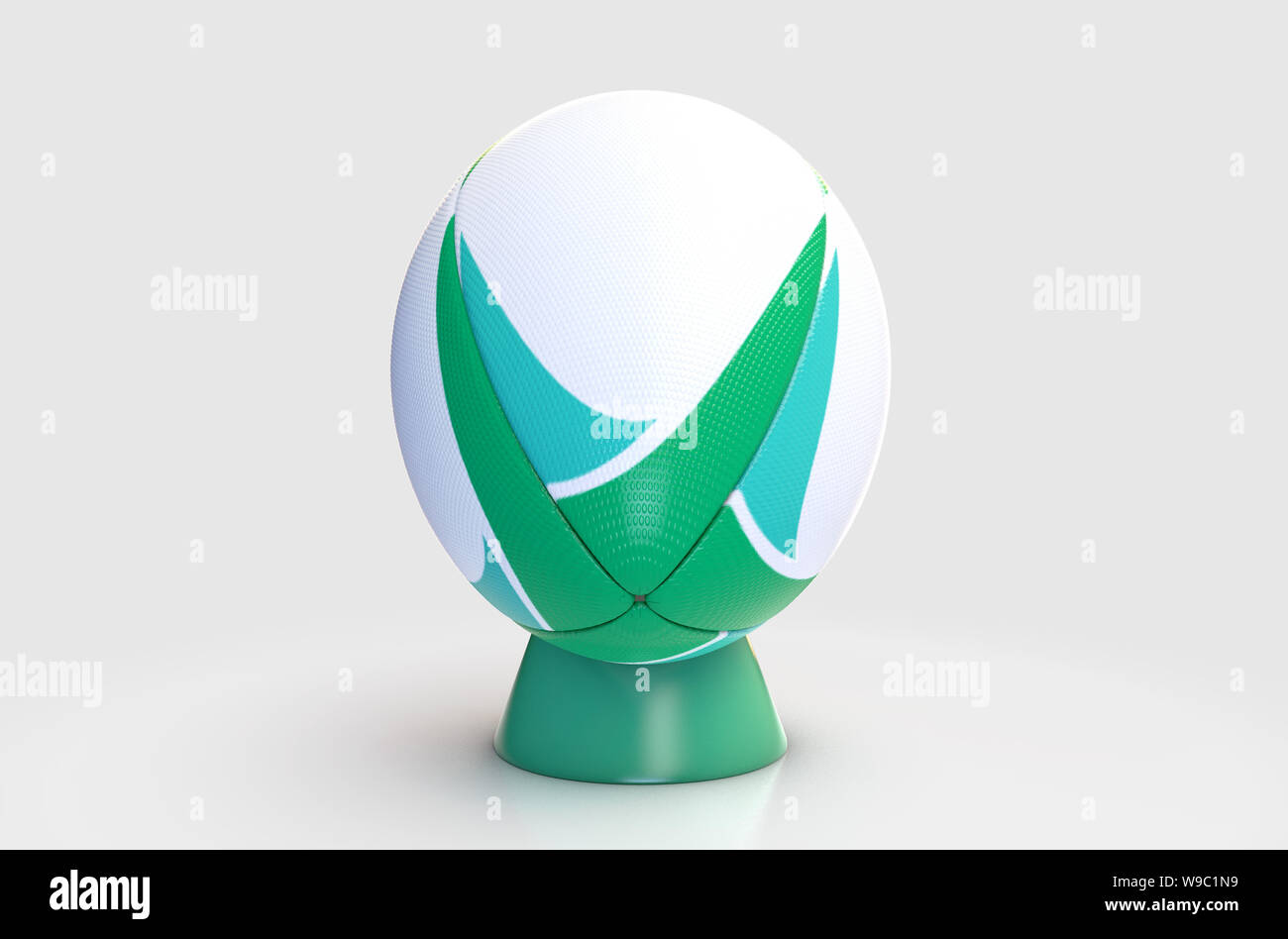 Un bianco a trama palla da rugby con un green design pattern in appoggio su di un verde kicking tee su un isolato sfondo bianco - 3D render Foto Stock