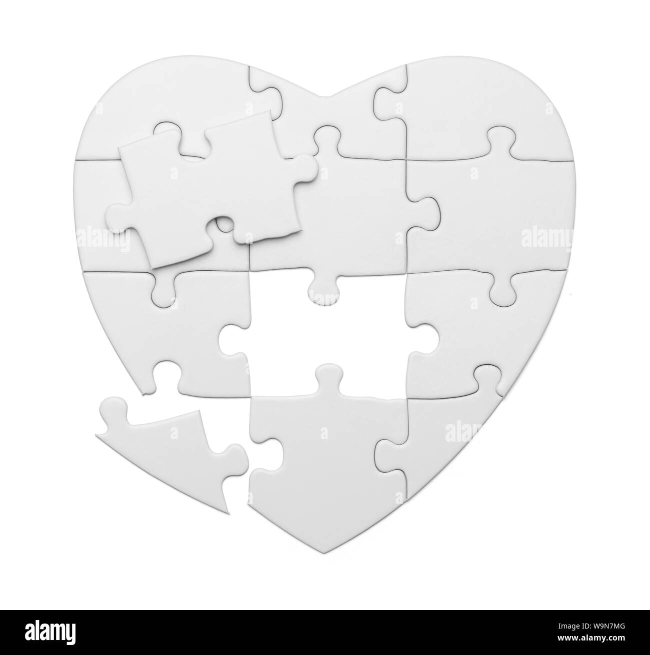 Puzzle cuore pezzi isolati su sfondo bianco. Foto Stock