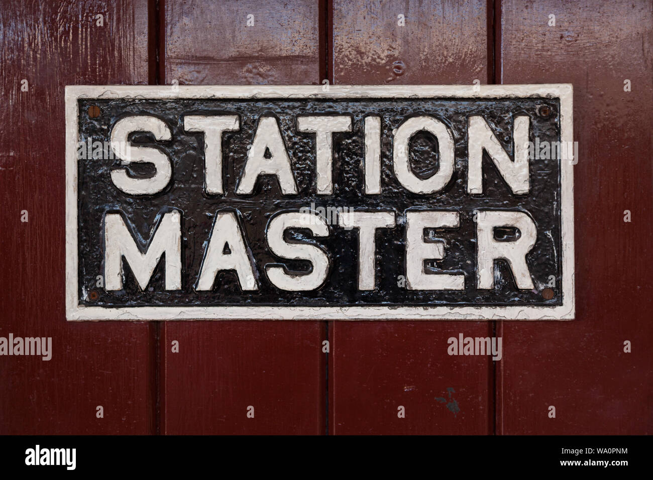 Antica Stazione master segno sulla piattaforma della stazione Foto Stock