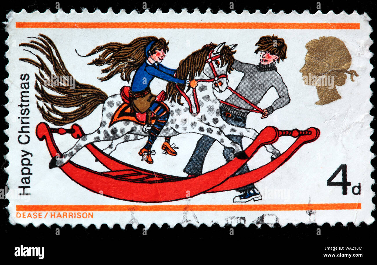 Un ragazzo e una ragazza con il cavallo a dondolo, Felice Natale, francobollo, UK, 1968 Foto Stock