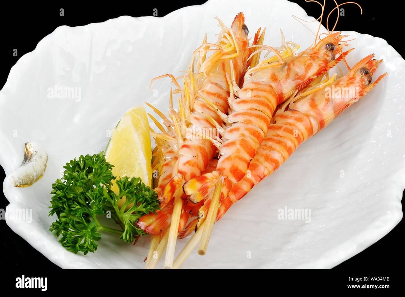 Ferro ferro giapponese sfrigolanti gamberetti gamberi arrosto Foto Stock