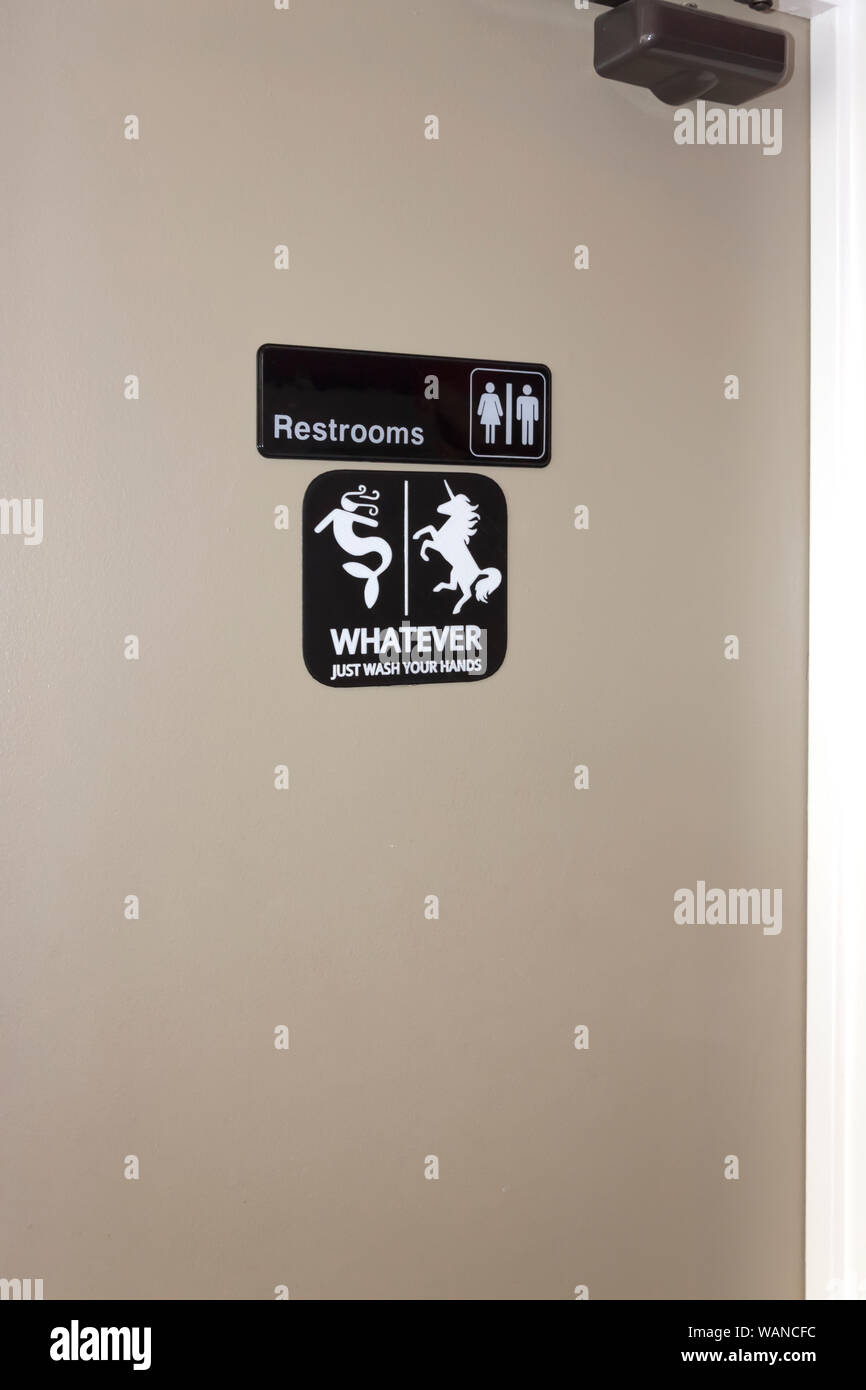 Qualunque sia il segno inviato sulla porta di una toilette. Foto Stock