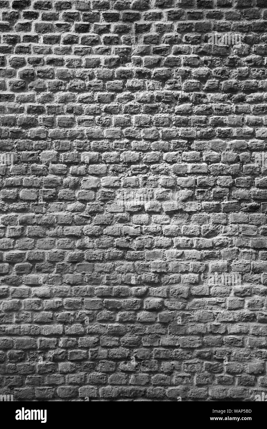 Un muro di mattoni come sfondo Foto Stock