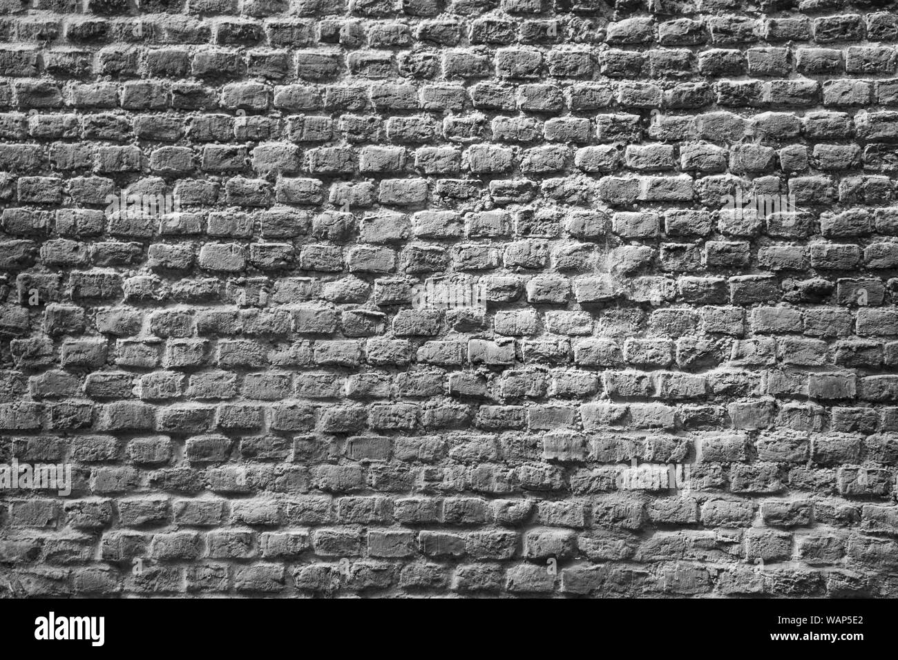 Un muro di mattoni come sfondo Foto Stock